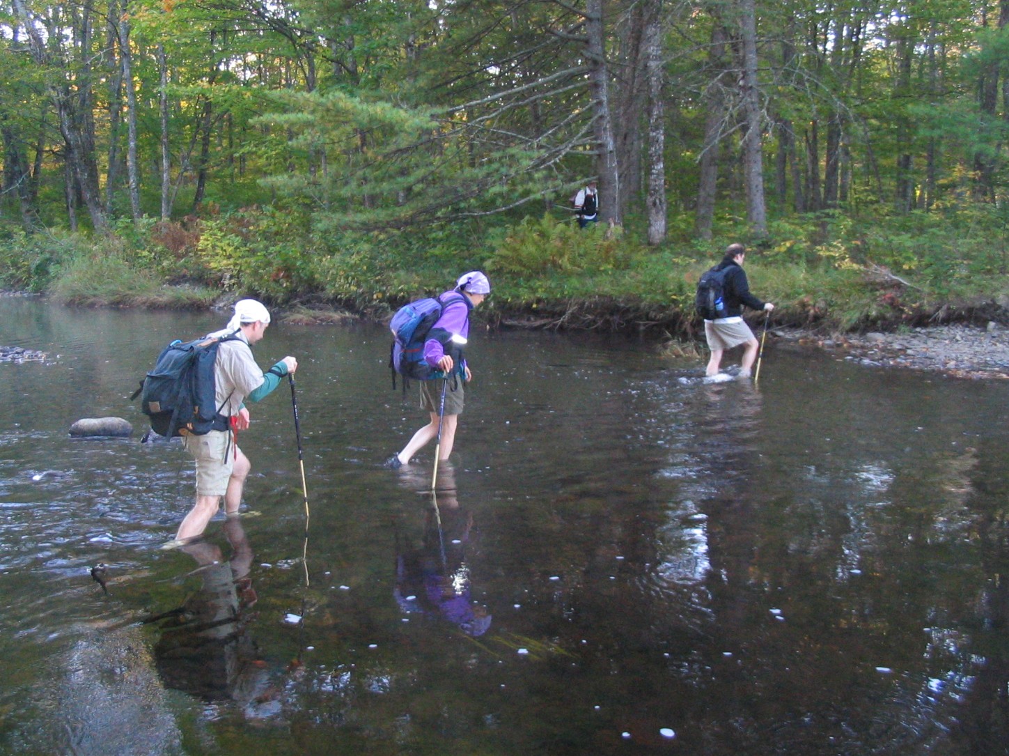 6.7 MM. Dean, Josh, Veronica and Dave are fording the East Branch of the Piscataquis River. If you start at Shirley-Blanchard Road start out in your water shoes as the ford is just .4 easy mile from the road. Courtesy askus3@optonline.net